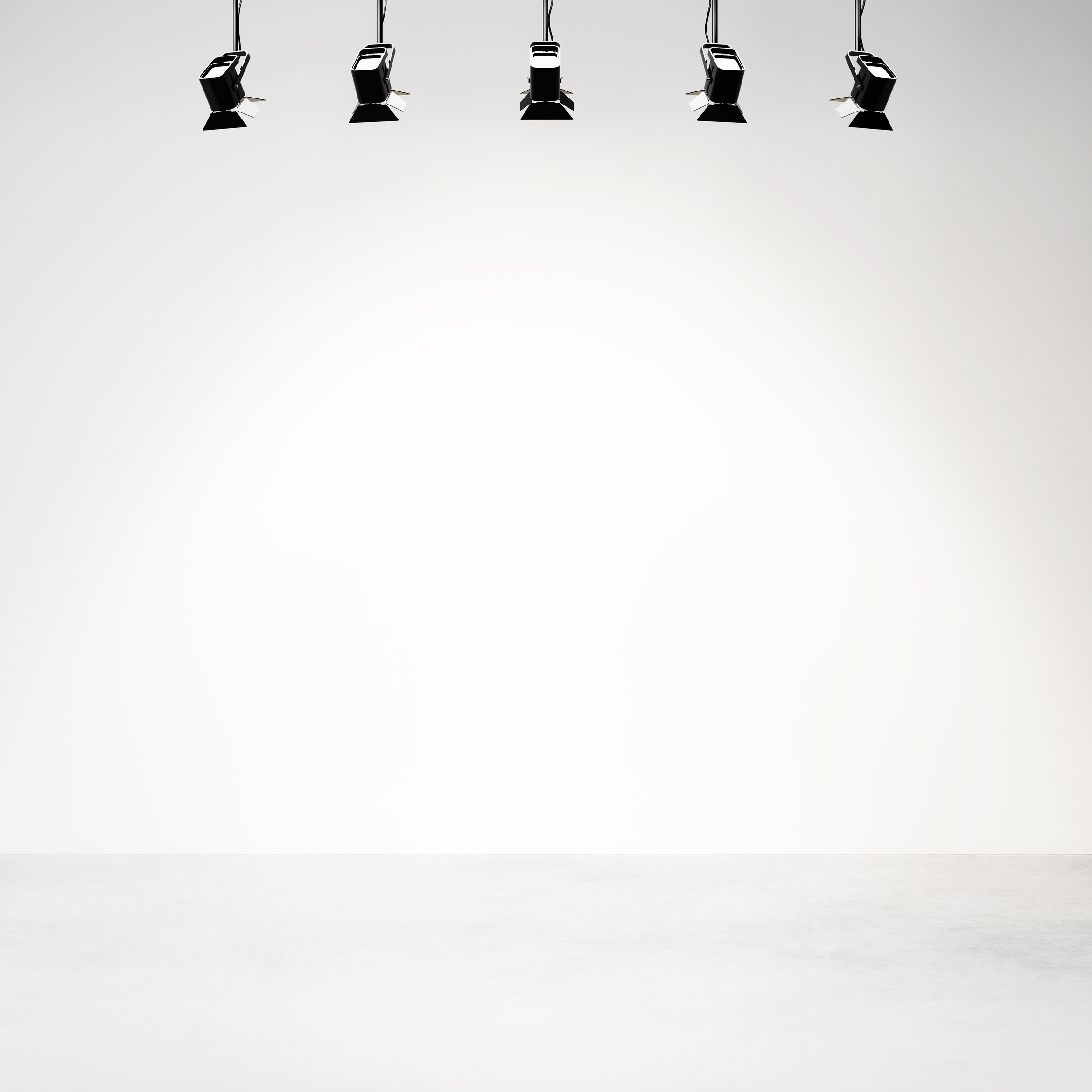 White studio background with spotlights